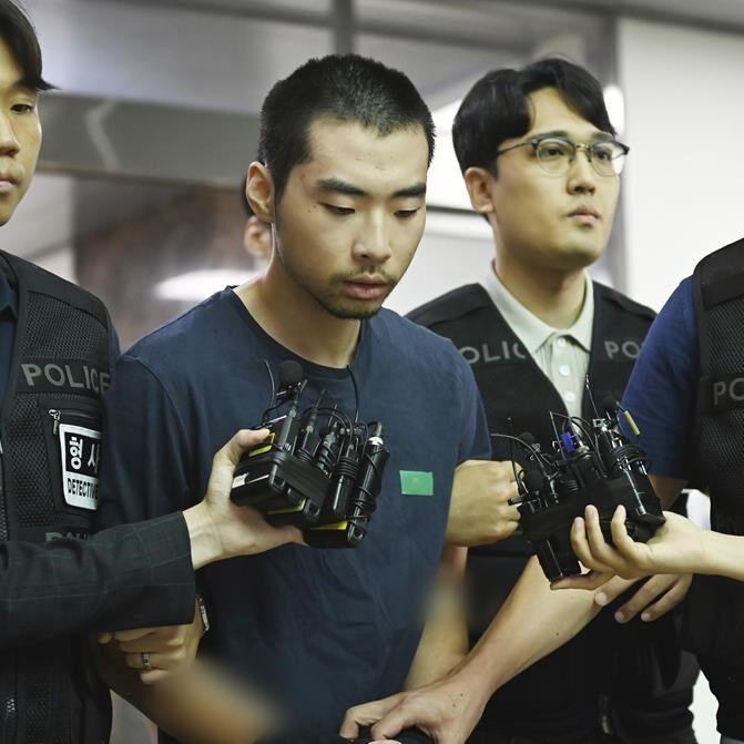 South Korean court convicts 23-year-old man in car-and-stabbing attack that killed 2 and injured 12